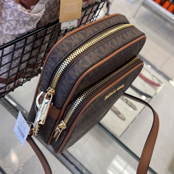 MICHAEL KORS 
Jet Set Travel Medium Logo Crossbody Flight Bag
# 35F1GTVC2B
Brown - Picture 11 of 16